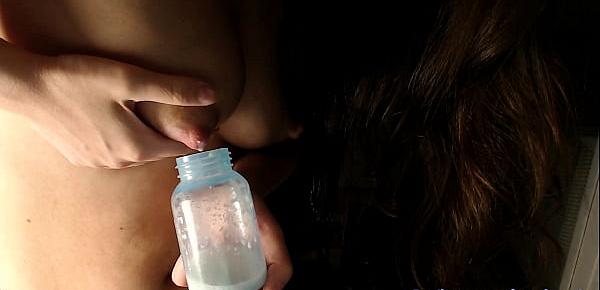  Cute young mom milking her boobies in bottle 3